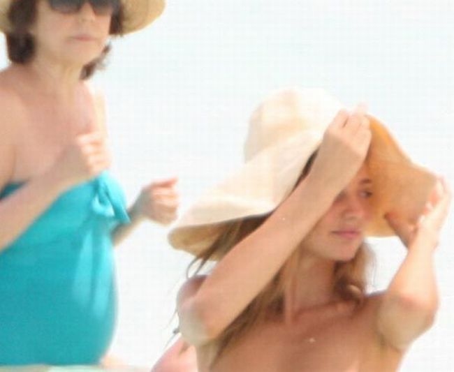 Miranda Kerr topless on the beach - 00