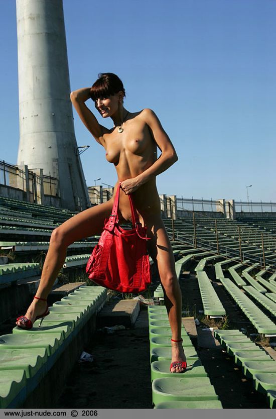 Nude babe Lena posing in the stadium - 02