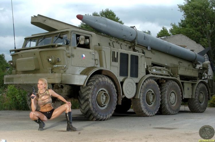 Badass photoshoot of busty Kathy Lee at a military base - 01