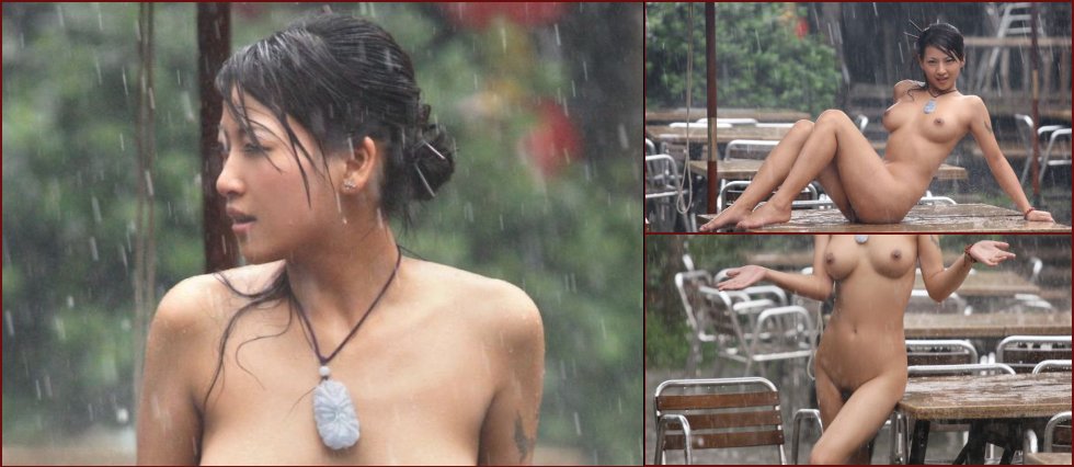 Charming Asian babe posing in the rain - 16