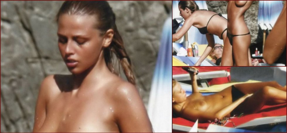 Italian actress Benedetta Valanzano taking a sunbath topless on vacation - 13