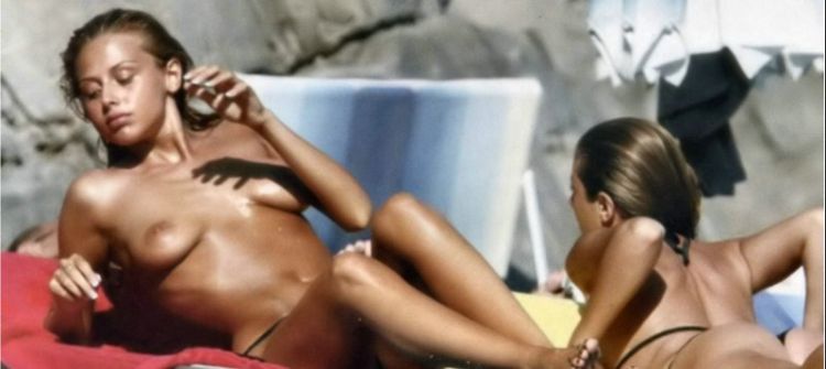 Italian actress Benedetta Valanzano taking a sunbath topless on vacation - 07
