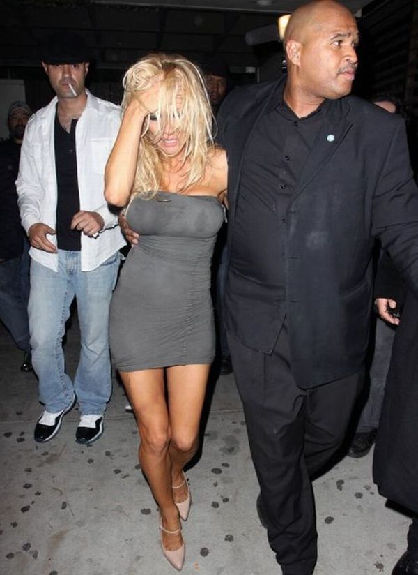 Drunk Pamela Anderson was taken out of the bar by the hands - 04