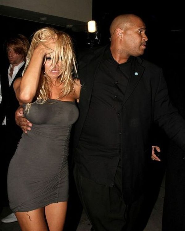 Drunk Pamela Anderson was taken out of the bar by the hands - 08
