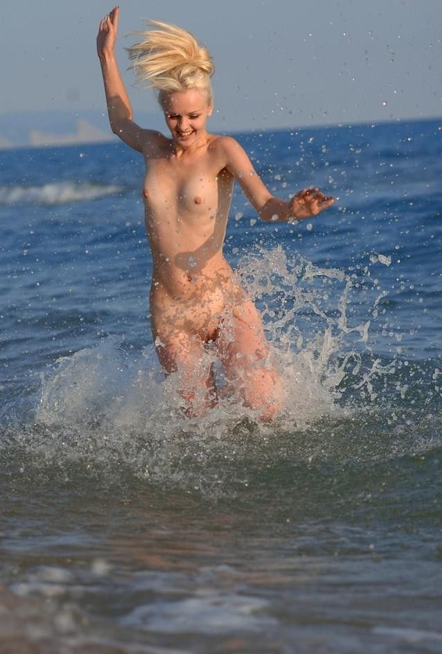 Funny poses on a nudist beach - 04