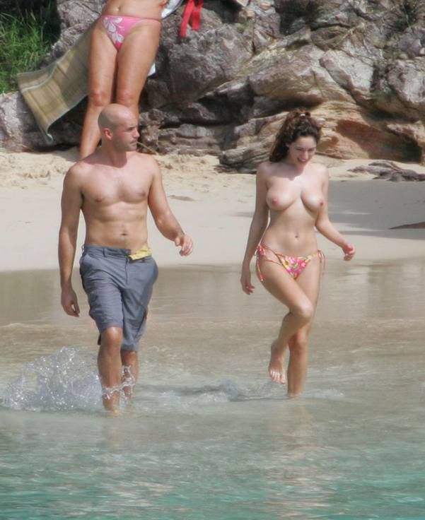 Kelly Brook rests topless on the beach - 05