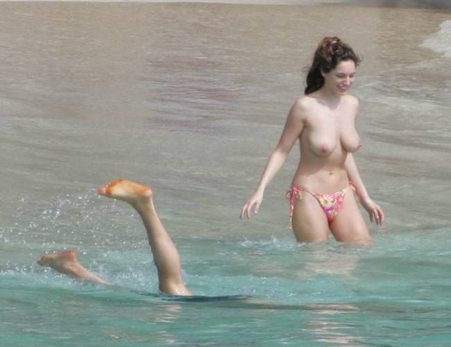 Kelly Brook rests topless on the beach - 07