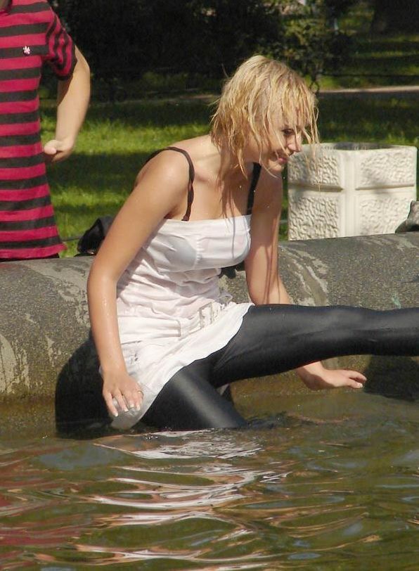 Amusing girls having fun in the fountains - 02