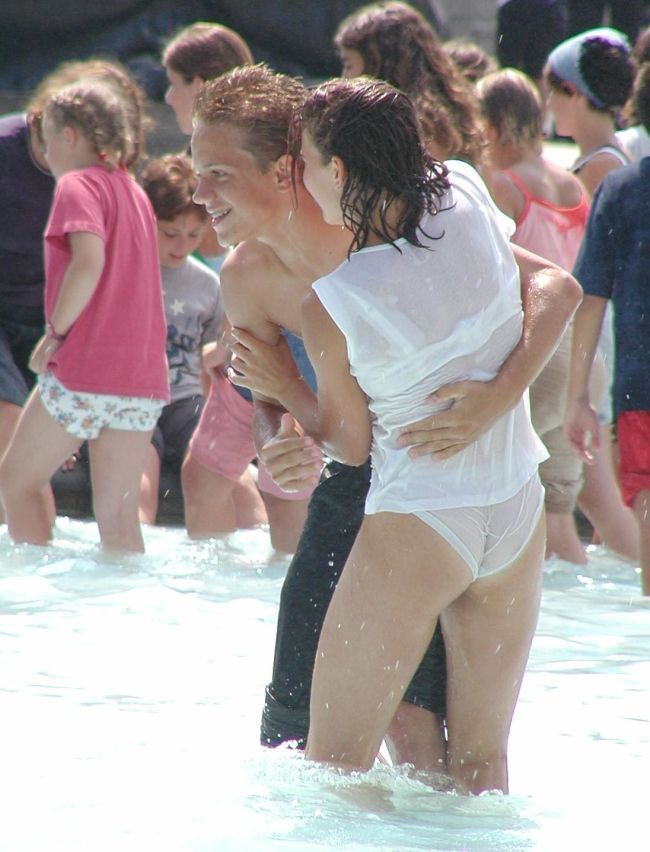 Amusing girls having fun in the fountains - 03