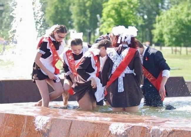 Amusing girls having fun in the fountains - 08