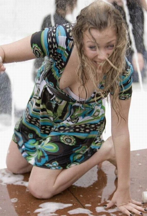 Amusing girls having fun in the fountains - 13