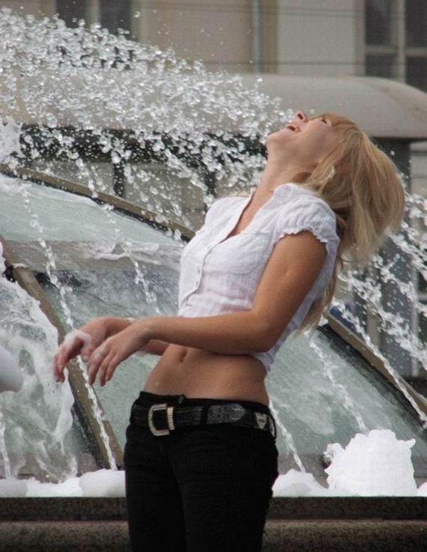 Amusing girls having fun in the fountains - 15