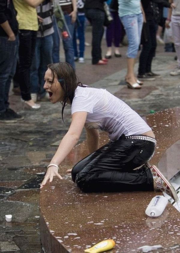 Amusing girls having fun in the fountains - 20