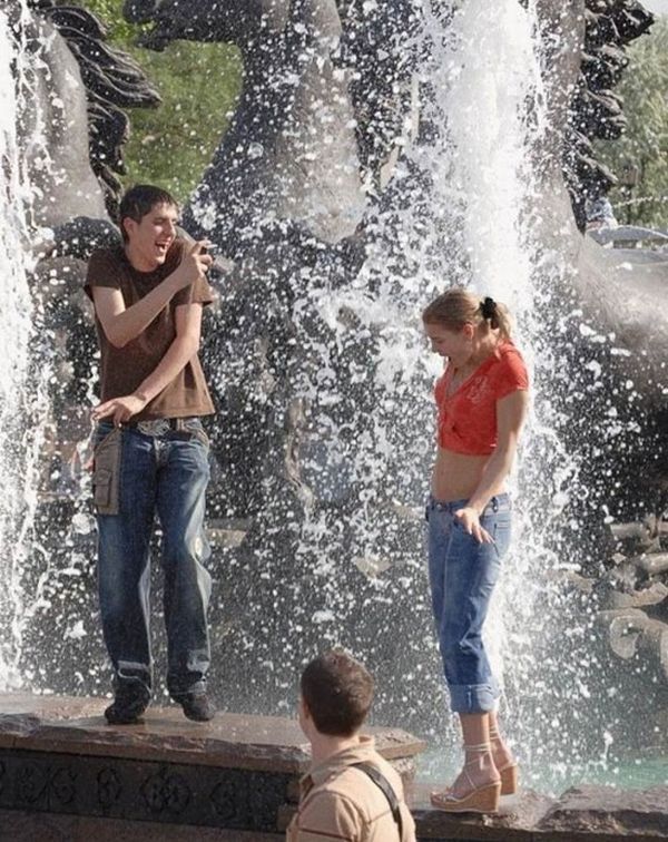 Amusing girls having fun in the fountains - 21