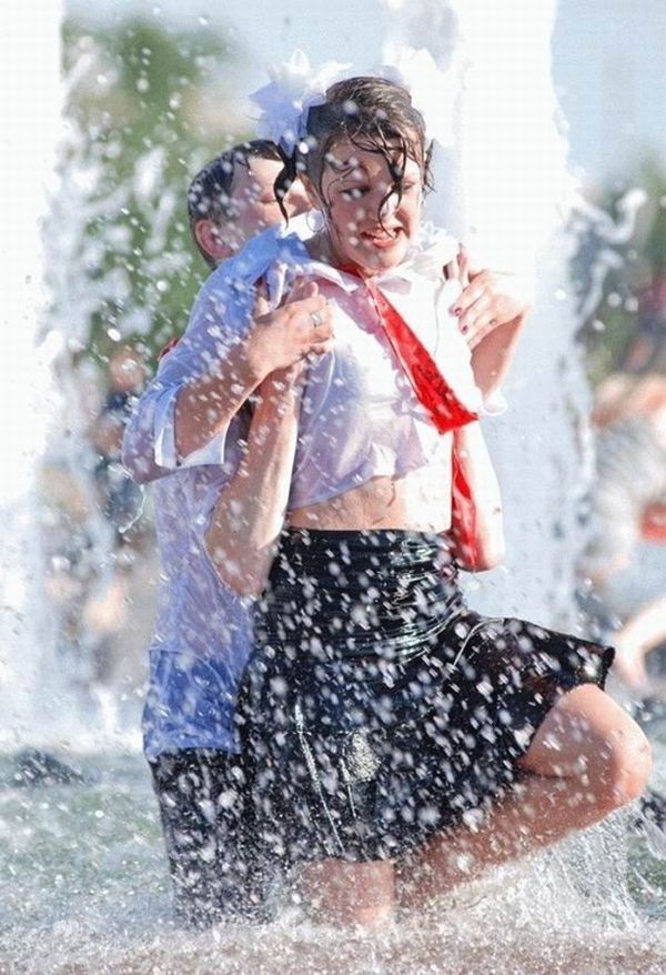 Amusing girls having fun in the fountains - 24