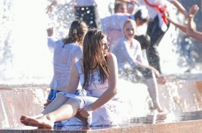 Amusing girls having fun in the fountains - 26