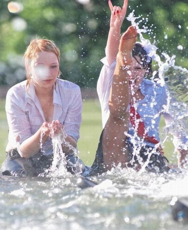 Amusing girls having fun in the fountains - 28