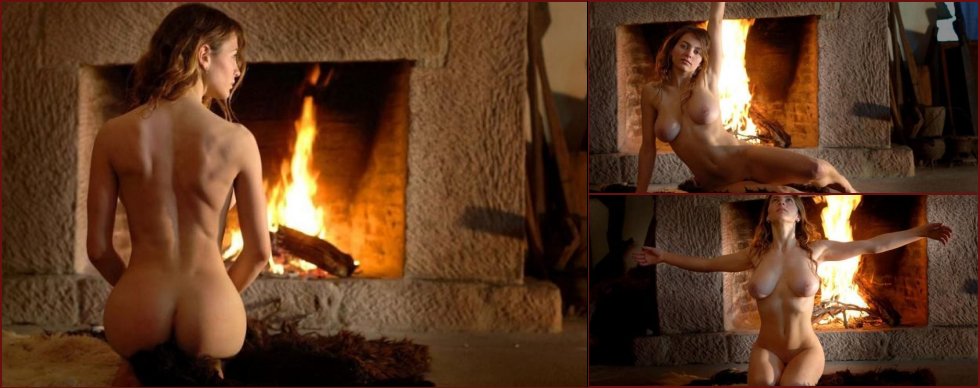 The beauty poising at a fireplace - 1